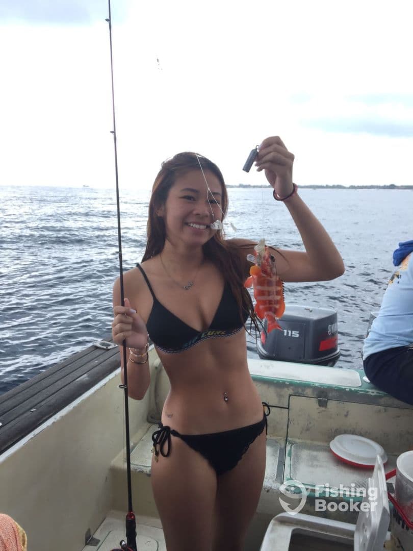 Happy guest holding a fresh catch